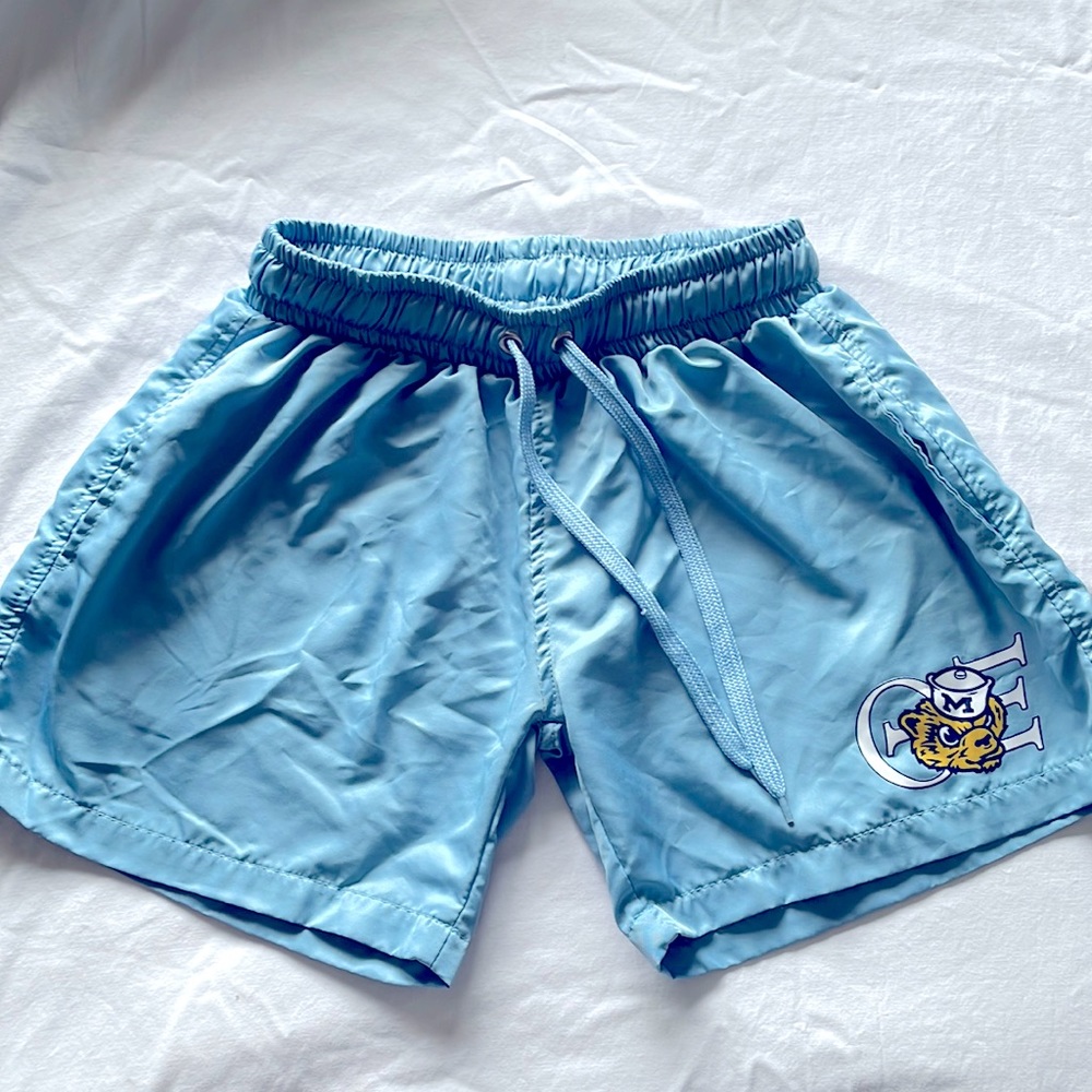 Light blue men’s short with Michigan and Theta Xi logo.